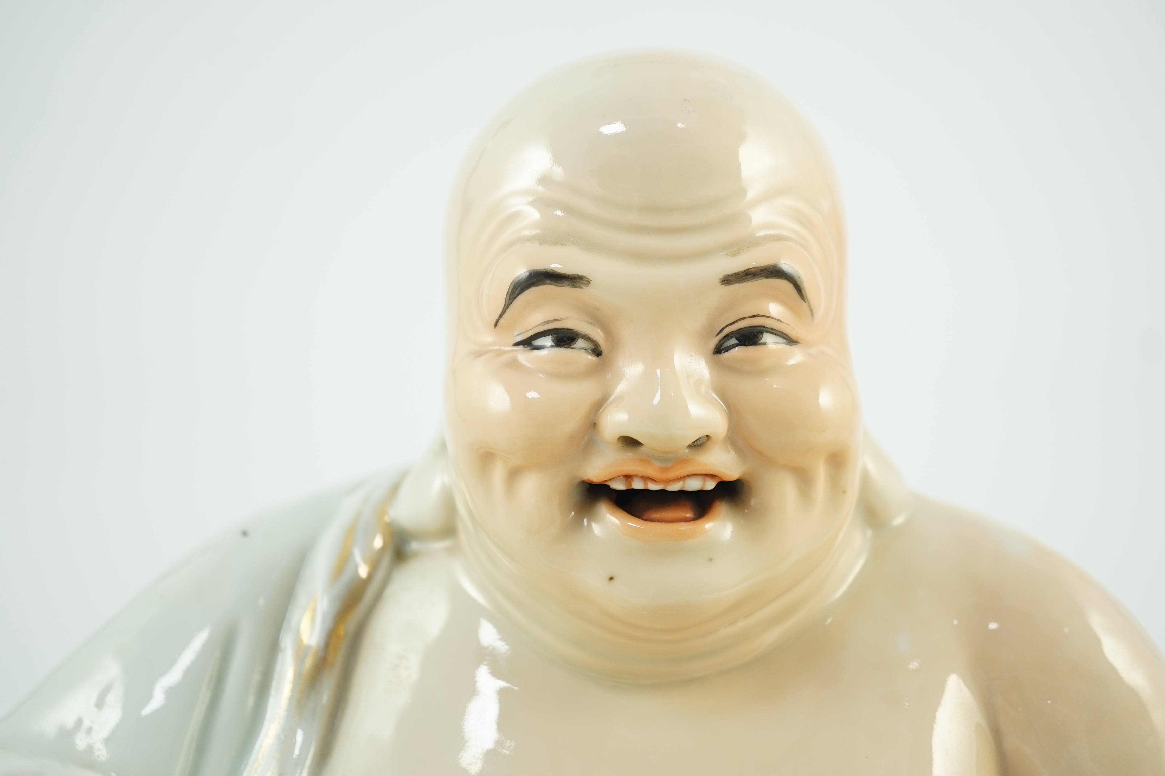 A large Chinese porcelain figure of Budai, Republic period, 25cms high